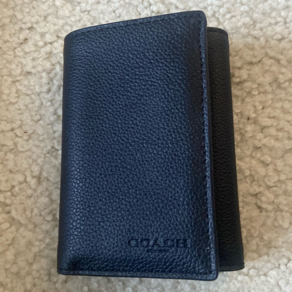 Coach - New with tags men’s trifold wallet.